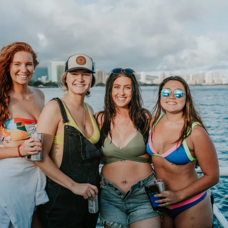 a person standing next to a body of water posing for the camera