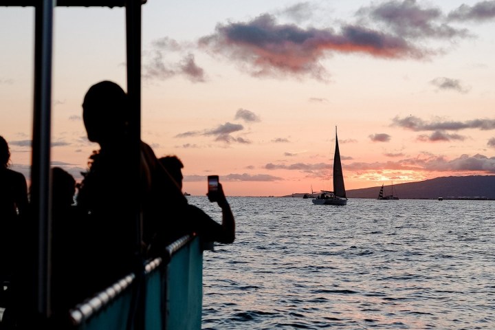 a couple of people that are standing in the water