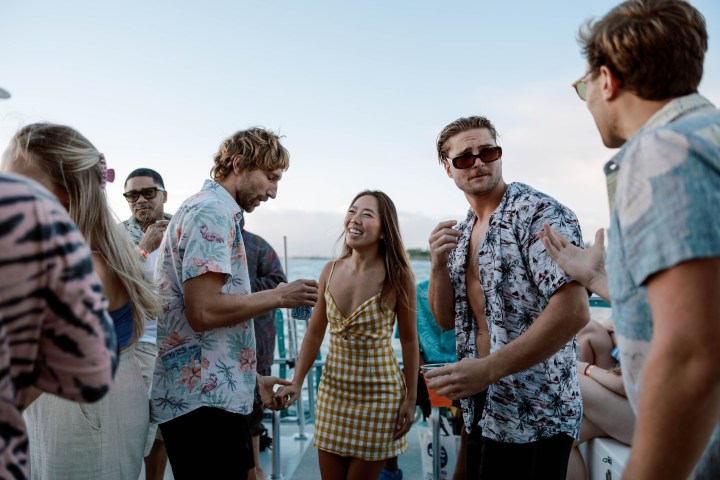 a group of people standing in front of a crowd