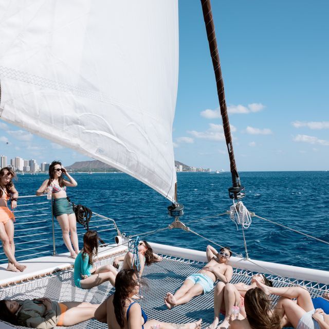 a group of people in a boat on a body of water
