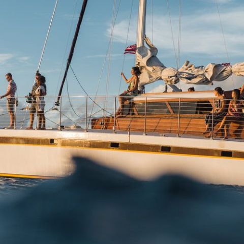 a group of people on a boat in the water