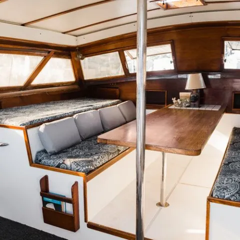 a bedroom with a bed and a chair in a room